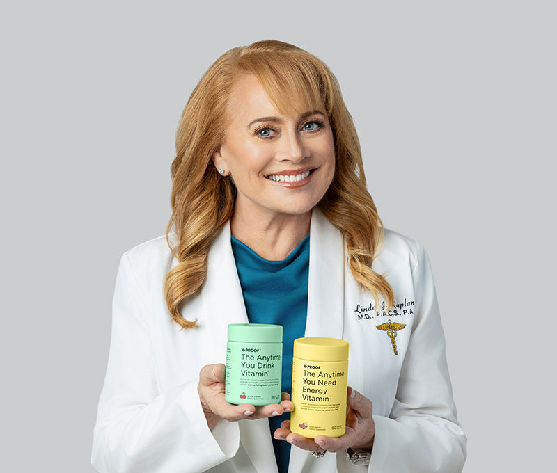 H-Proof co-founder Dr Linda Kaplan holding H-Proof Drink Vitamin