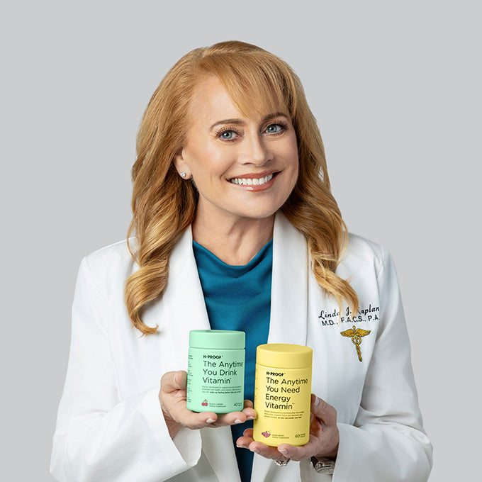 H-Proof co-founder Dr Linda Kaplan holding H-Proof vitamins